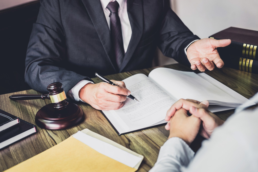 A lawyer talking to another man in an office